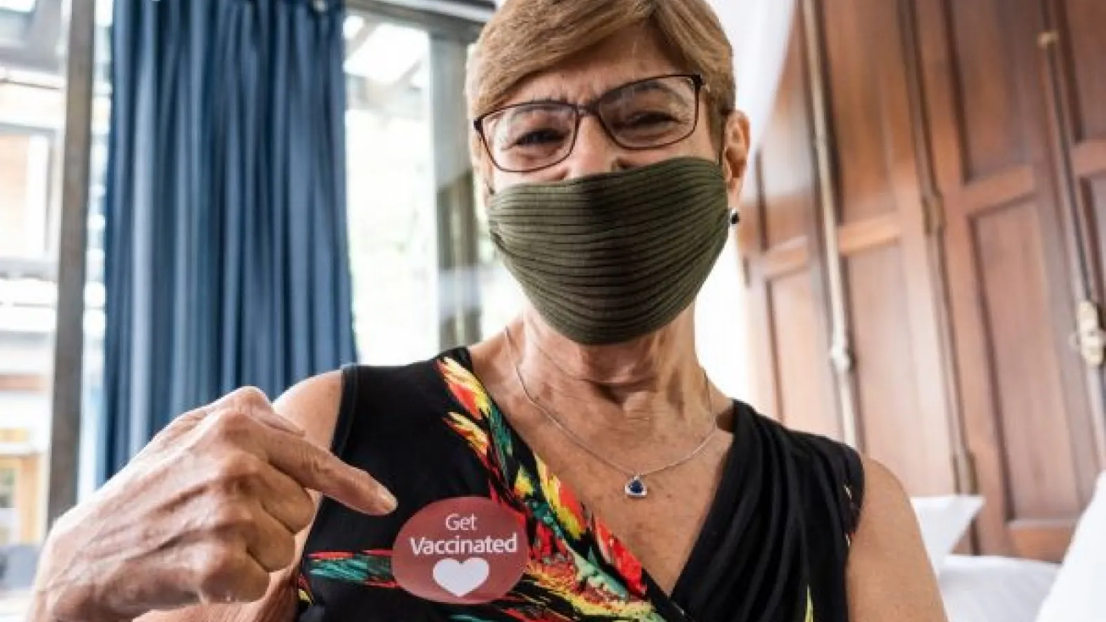 Person wearing a "Get Vaccinated" sticker